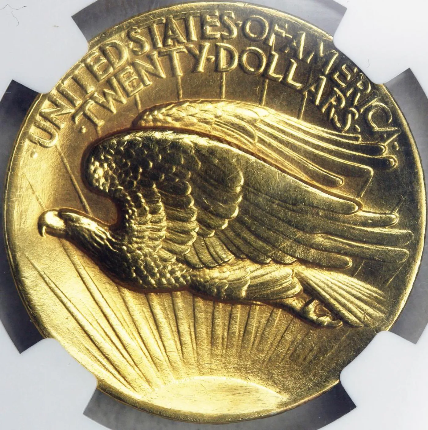 Reverse of a 1907 High Relief double eagle showing the eagle in flight with an empty field and no motto