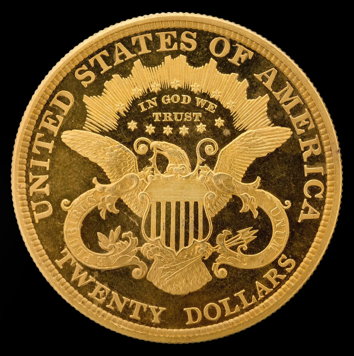 Reverse of a Type 3 Liberty Head double eagle showing IN GOD WE TRUST on a scroll above the heraldic eagle and TWENTY DOLLARS spelled out below