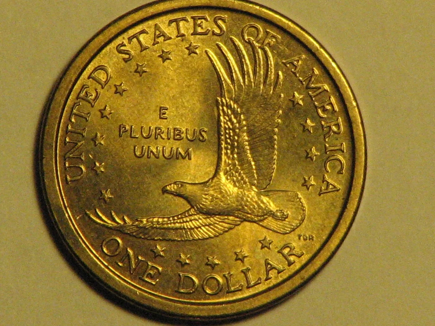 Reverse of a Sacagawea dollar showing a soaring eagle, UNITED STATES OF AMERICA, E PLURIBUS UNUM and ONE DOLLAR