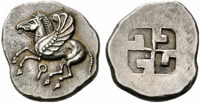 Obverse and reverse of an archaic silver stater of Corinth, a winged horse flying left above a letter shaped like a Q, and a four-armed sunken punch