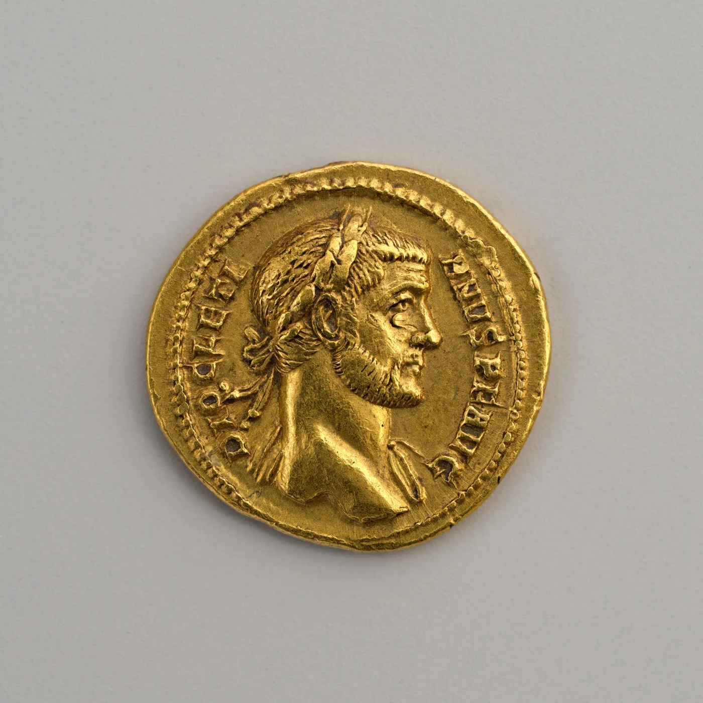 Gold aureus of Diocletian, laureate head facing right, the coin filling the frame