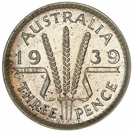 Reverse of a small silver Australian threepence dated 1939 showing three stalks of wheat tied with a ribbon