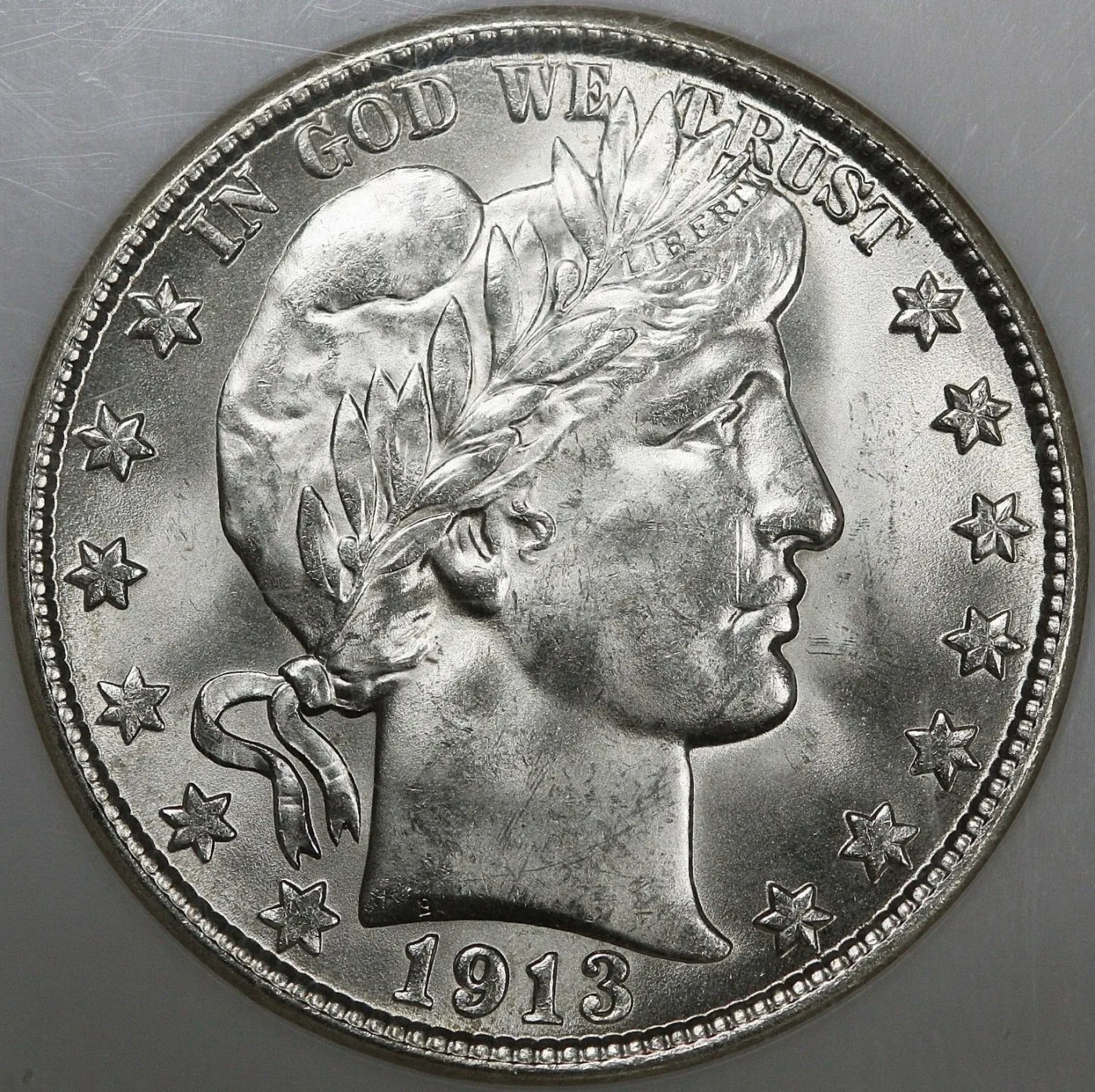 Obverse of an uncirculated 1913-D Barber half dollar, showing Liberty facing right in a laurel-wreathed cap with LIBERTY sharp on the headband and the date 1913 below the bust