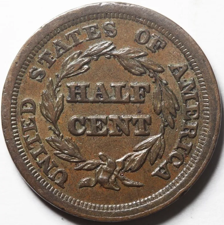 Reverse of a lightly circulated 1853 Braided Hair half cent with bold HALF CENT lettering and wreath leaves that retain most of their detail