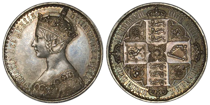Obverse and reverse of an 1847 British crown, a crowned Gothic-style portrait of Victoria and a cruciform arrangement of four shields, the lettering in a medieval script