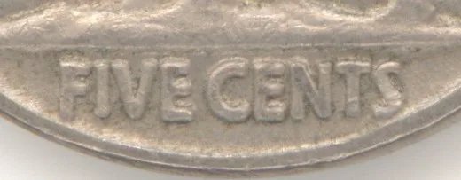 Close crop of the bottom of a Buffalo nickel reverse showing FIVE CENTS with bare field between the lettering and the rim