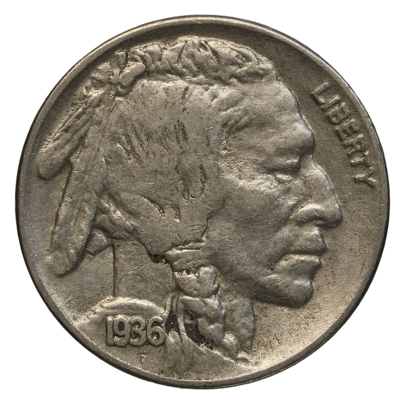 Obverse of a circulated Buffalo nickel dated 1936, the cheekbone worn flat and the hair above the braid reduced to a smooth mass