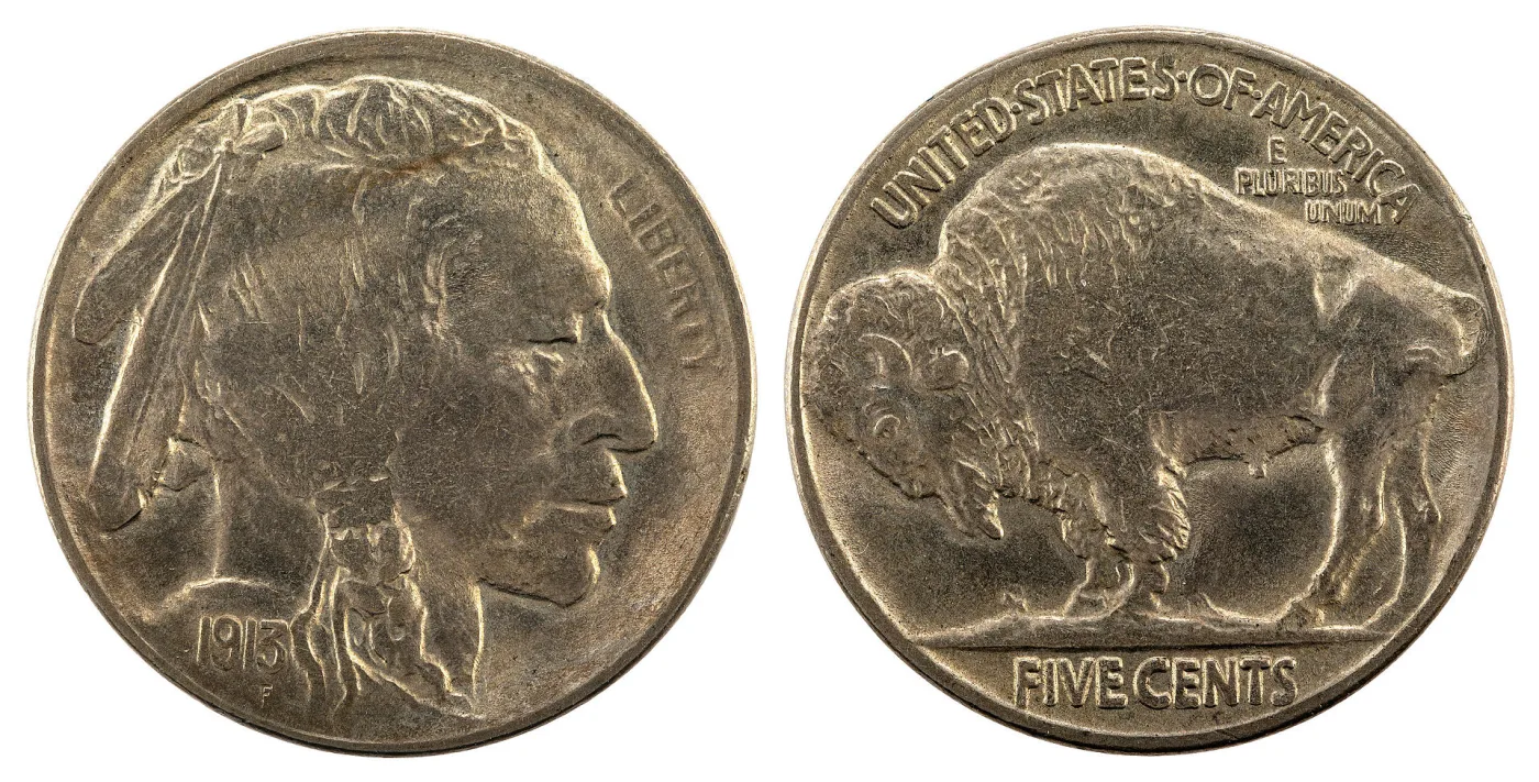 Obverse and reverse of a 1913 Buffalo nickel side by side, the chief in left profile on the left and the bison on a flat line on the right