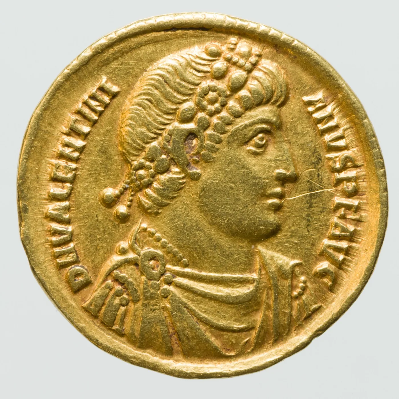Obverse of a fourth-century Roman gold solidus, a diademed head in profile facing right with a Latin legend around it