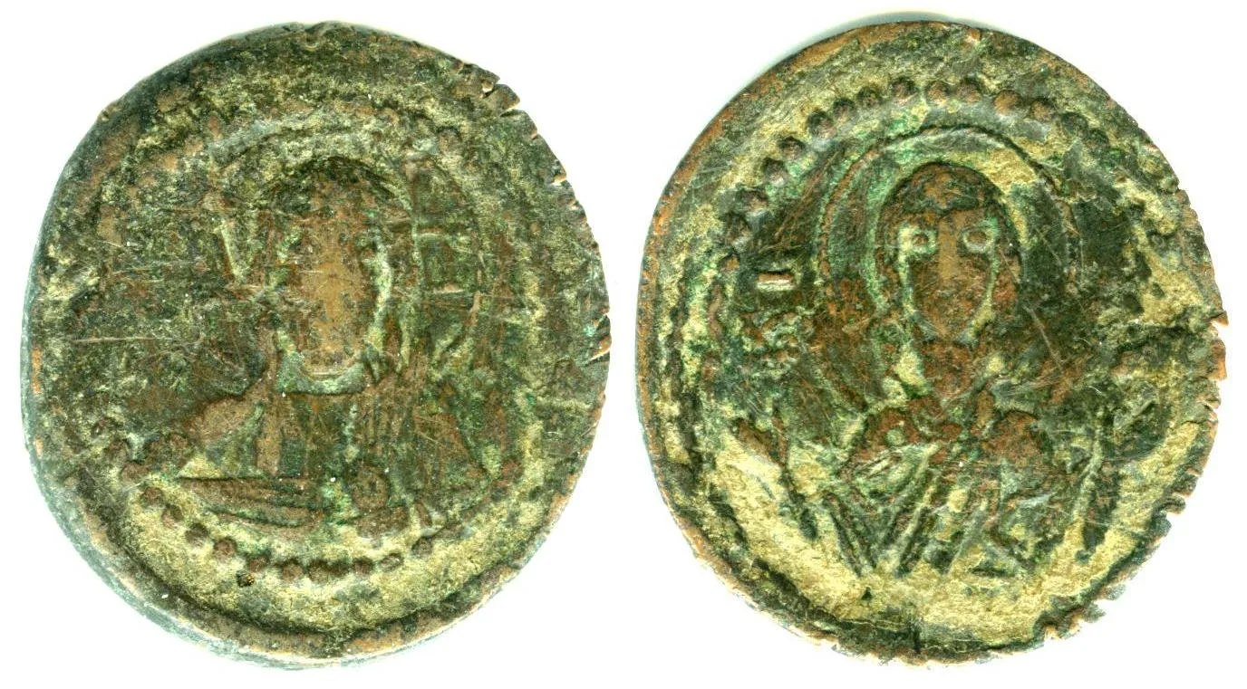 Obverse and reverse of a green-patinated Byzantine copper follis, a facing bust of Christ on one side and a facing figure with both hands raised on the other