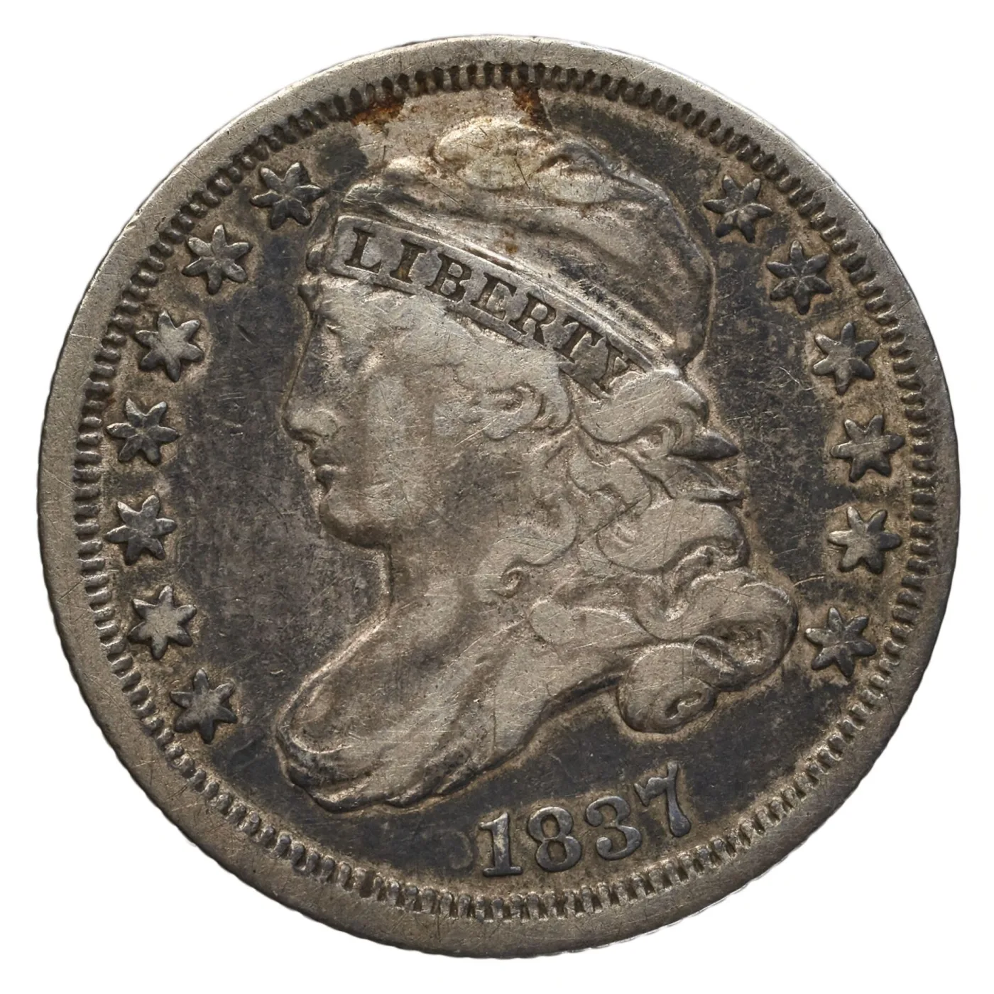 Obverse of a circulated 1837 Capped Bust dime with all seven letters of LIBERTY readable on the headband but the cheek and cap rubbed smooth