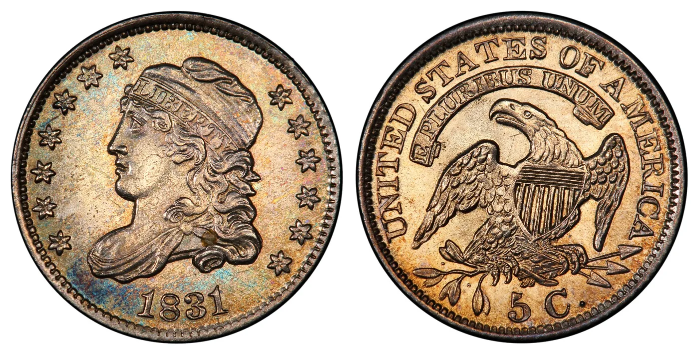 Obverse and reverse of a lightly worn 1831 Capped Bust half dime shown side by side, with LIBERTY complete on the cap band and full feather detail on the eagle