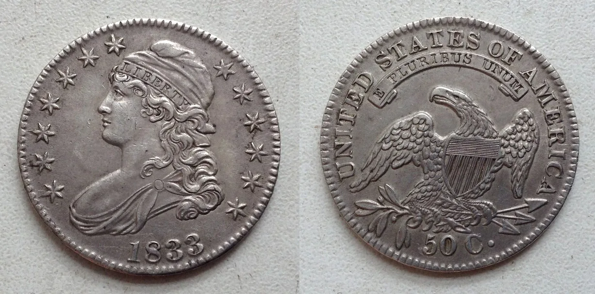 Obverse and reverse of a circulated 1833 Capped Bust half dollar, a common-date lettered-edge example with even honest wear