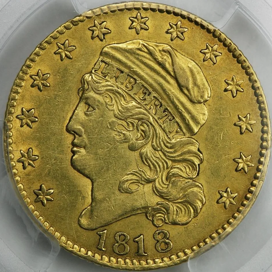 Obverse of an 1818 half eagle in a PCGS holder, Liberty facing left with every letter of LIBERTY clear on the cap band