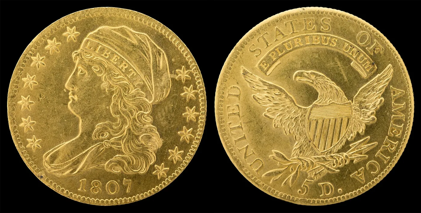 Obverse and reverse of an 1807 half eagle, Liberty facing left with LIBERTY on the cap band, and a heraldic eagle reverse lettered 5 D.
