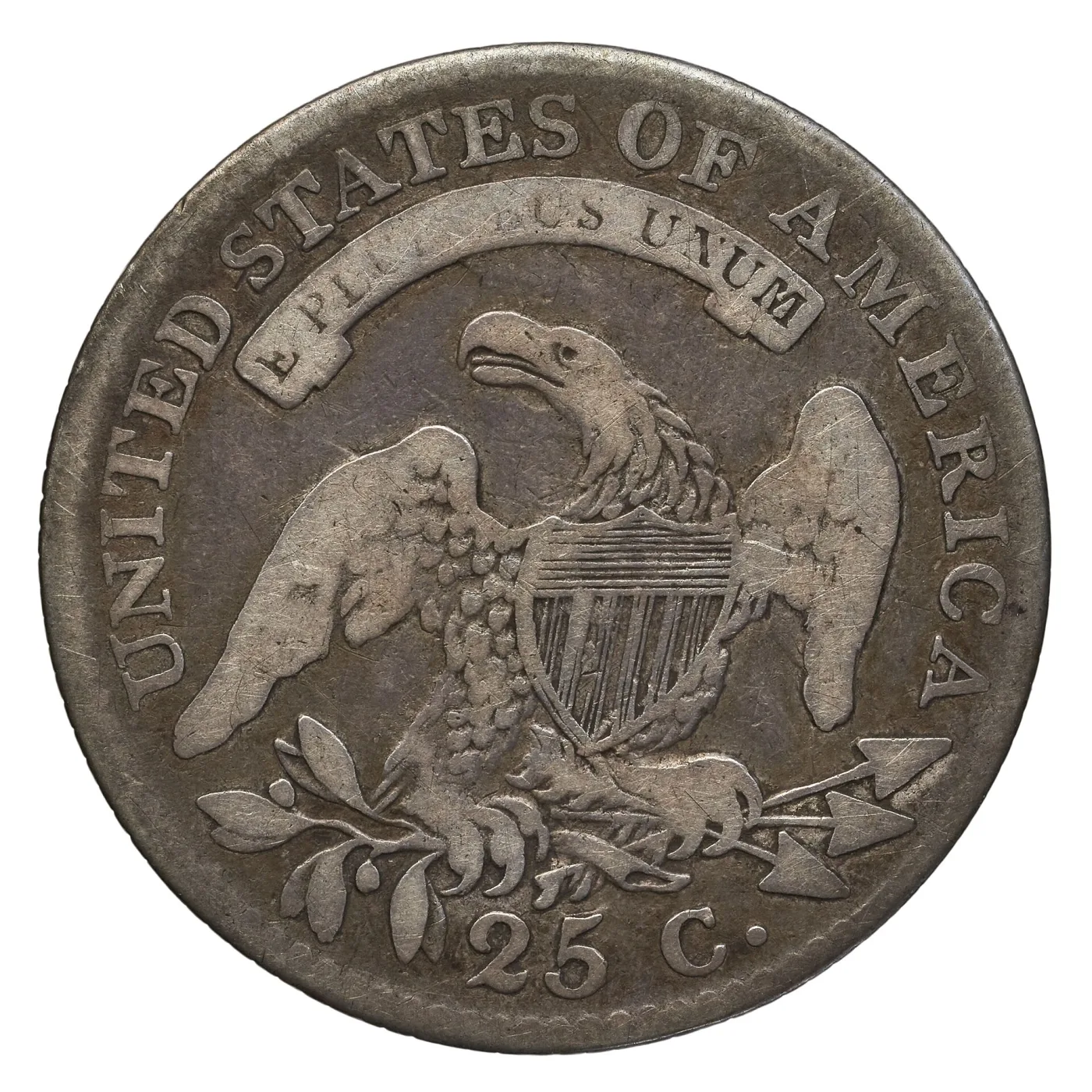 Reverse of the same circulated 1815 Capped Bust quarter, the eagle's breast worn smooth and the middle letters of E PLURIBUS UNUM missing while the outer legend stays sharp