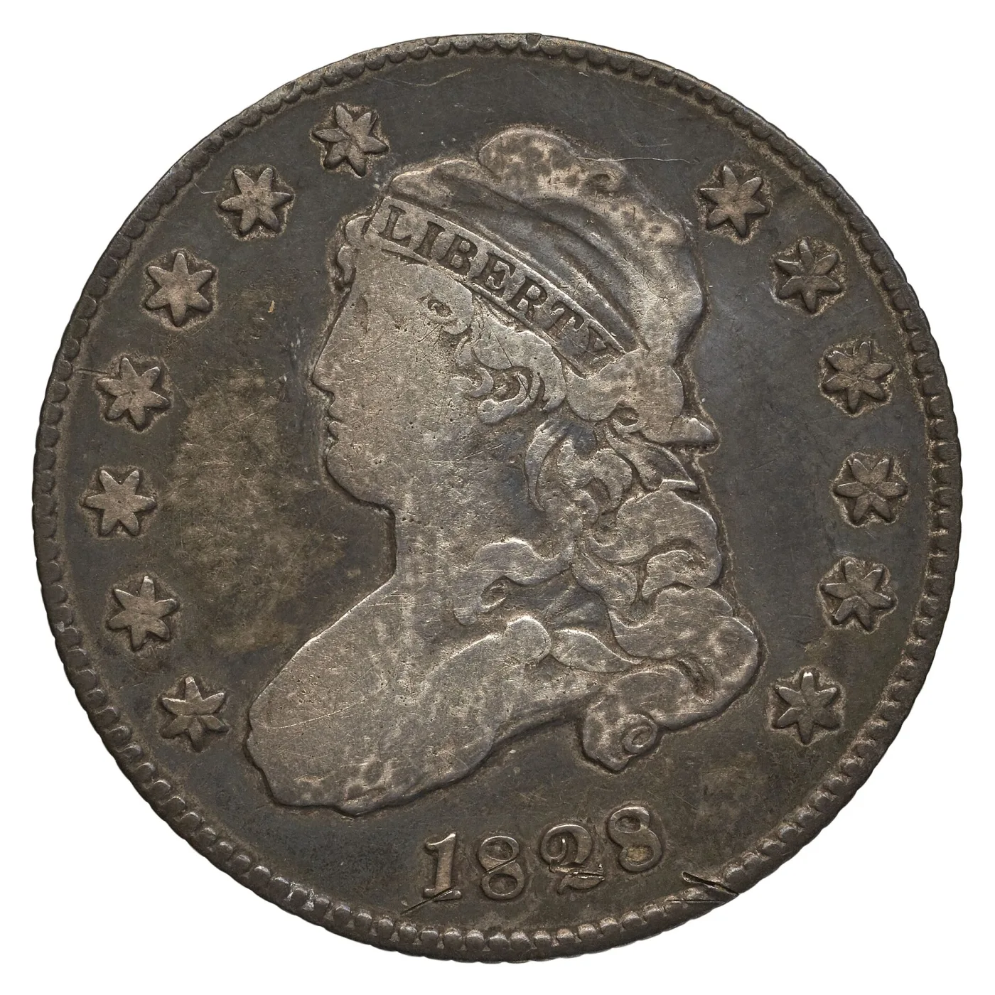 Obverse of an 1828 Capped Bust quarter, moderately circulated, with 1828 clear below the bust