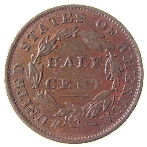Reverse of a circulated 1834 Classic Head half cent, HALF CENT bold but the wreath leaves worn flat
