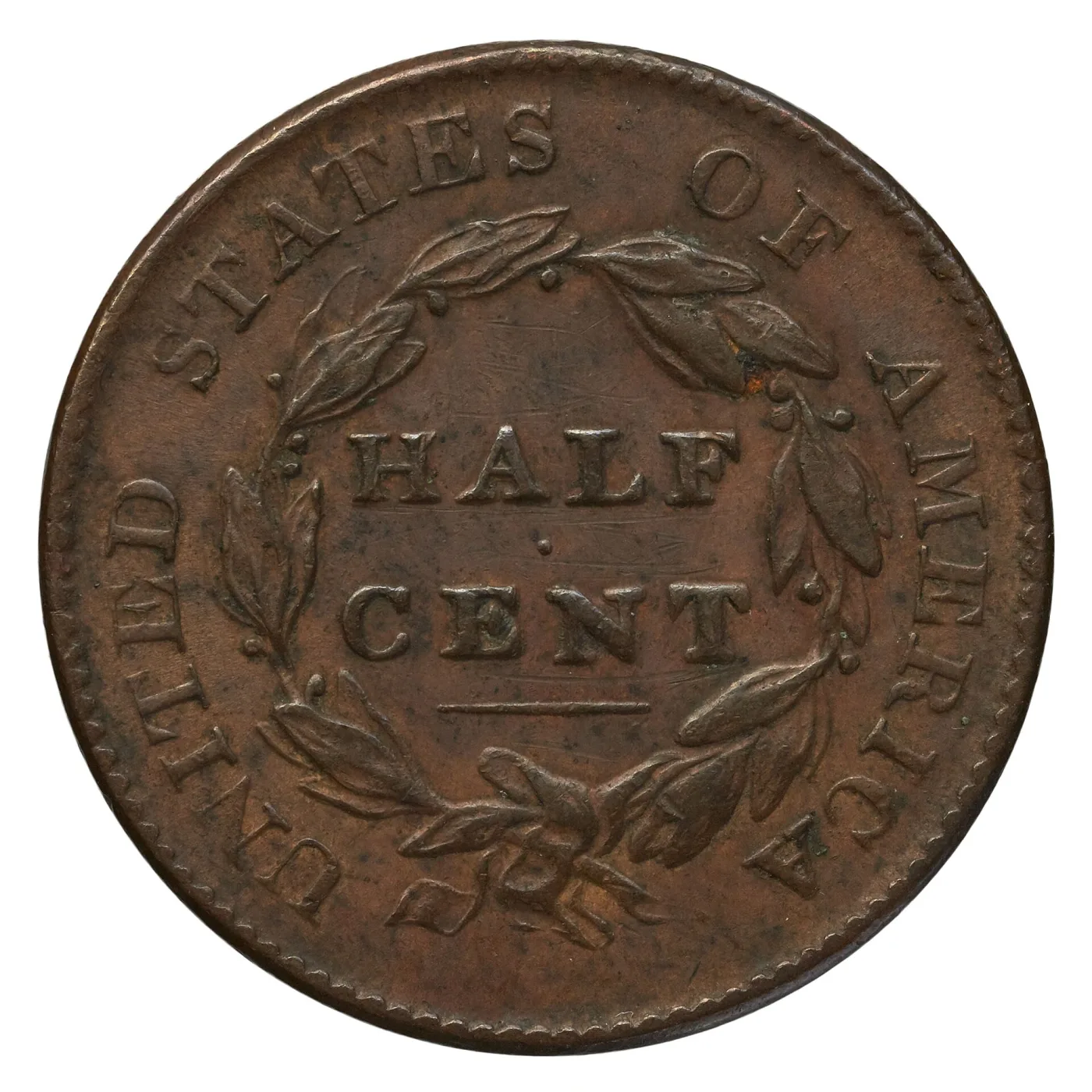 Reverse of an 1825 Classic Head half cent showing HALF CENT within a wreath, the leaves lightly worn and the fields showing fine scratches