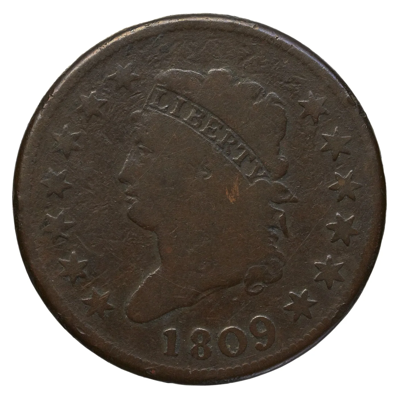 Obverse of an 1809 Classic Head large cent, the key date, with dark granular surfaces and the date 1809 standing clear below the bust
