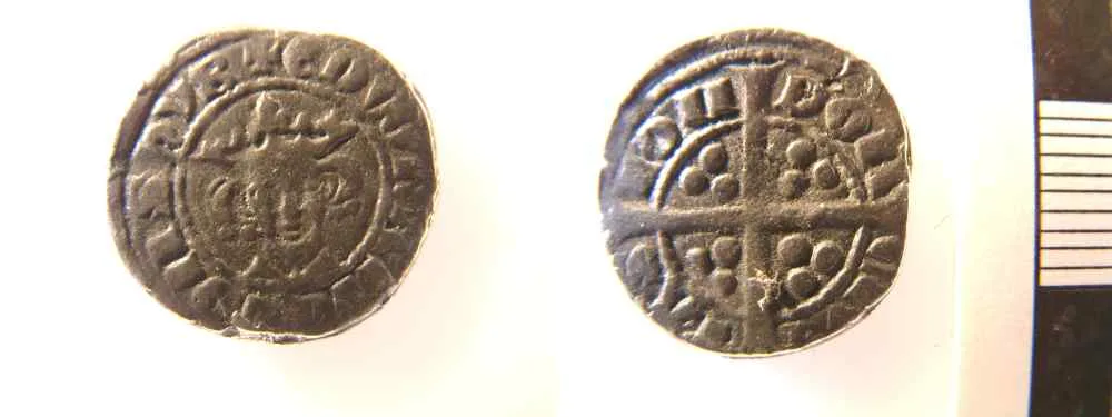 Two faces of a small silver coin imitating a penny of Edward I, the lettering irregular and the portrait crude