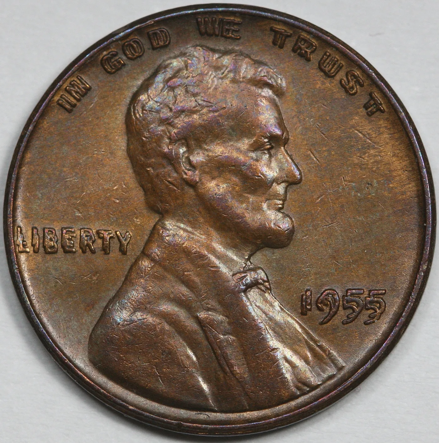 Obverse of a 1955 doubled die Lincoln cent, the date and both mottoes showing a clear second image offset to the right