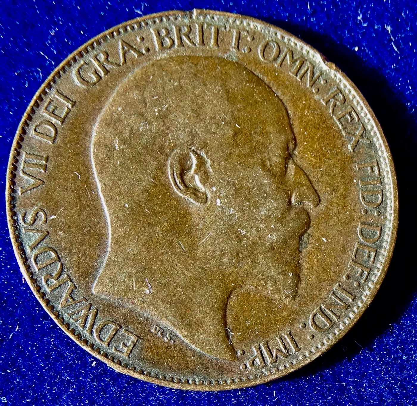 The other face of the same halfpenny, showing the same Edward VII portrait and legend rather than a reverse design