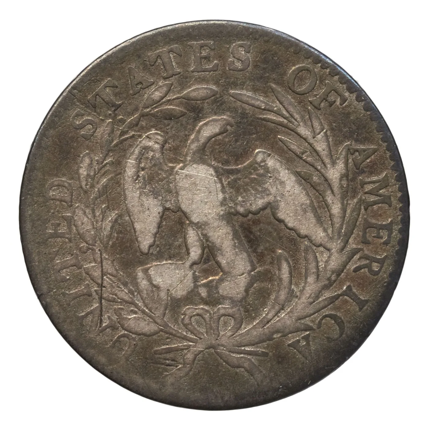 Heavily worn Small Eagle reverse of a Draped Bust dime, with the eagle's breast and wing tops smoothed flat while the wreath and rim legend survive