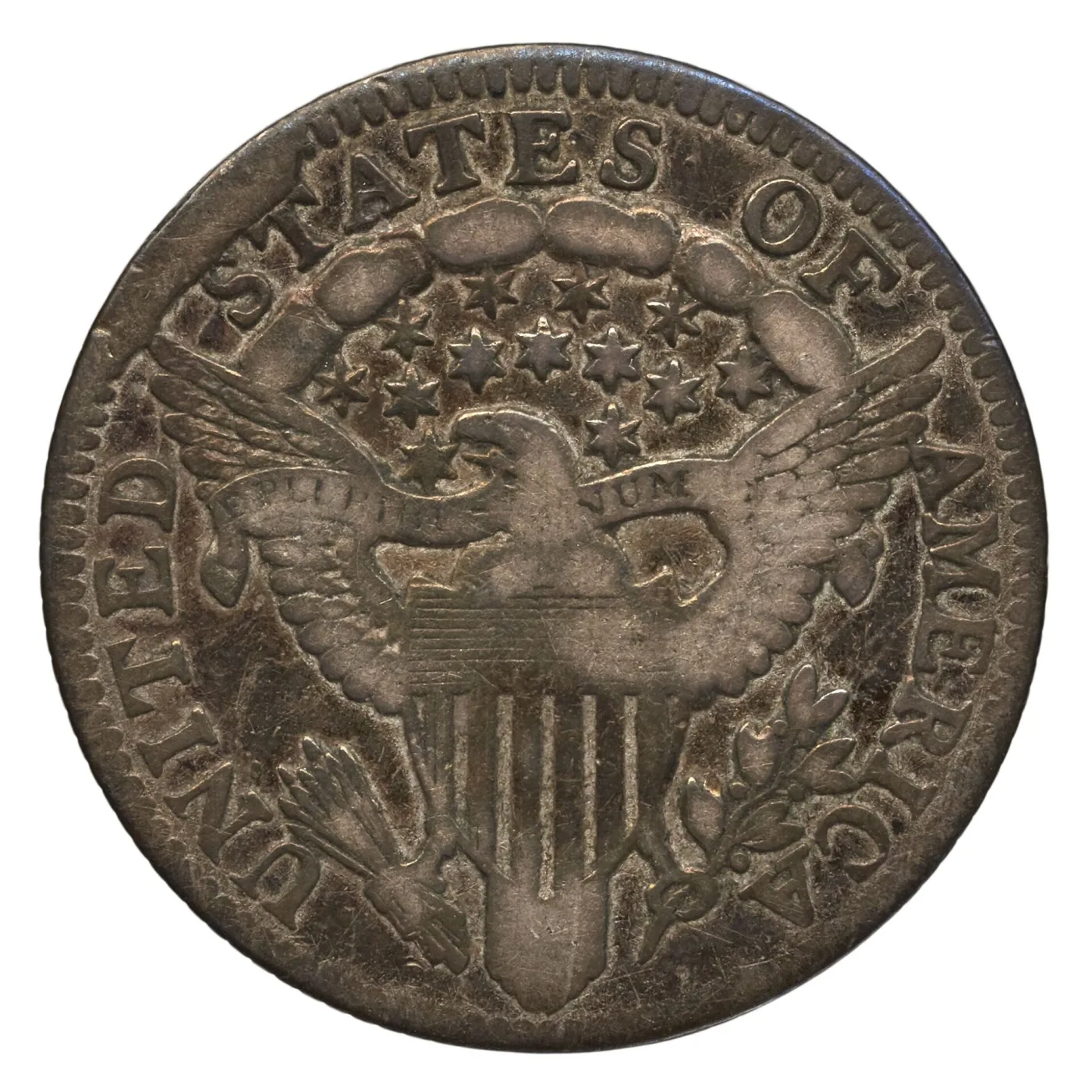 Heraldic Eagle reverse of an 1805 Draped Bust dime, showing the olive branch of leaves and small round berries in the eagle's talon at lower right