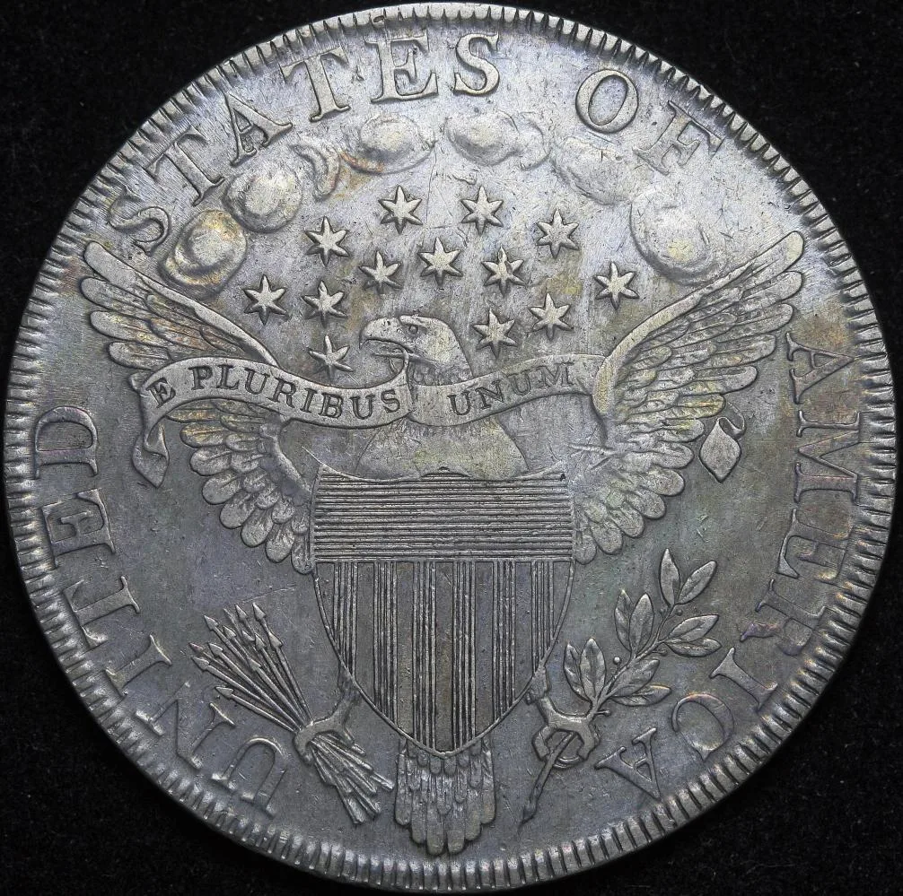 Reverse of the same 1798 Draped Bust dollar showing a heraldic eagle with a striped shield, a banner reading E PLURIBUS UNUM and thirteen stars among clouds above