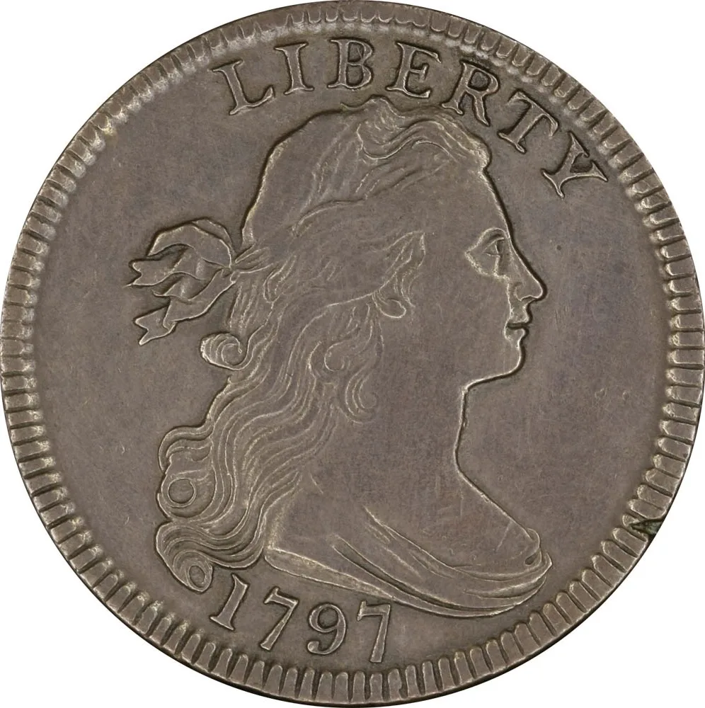 Obverse of a grey-brown 1797 large cent, Liberty facing right with flowing ribboned hair and drapery across the bust, LIBERTY arched above and the date 1797 below