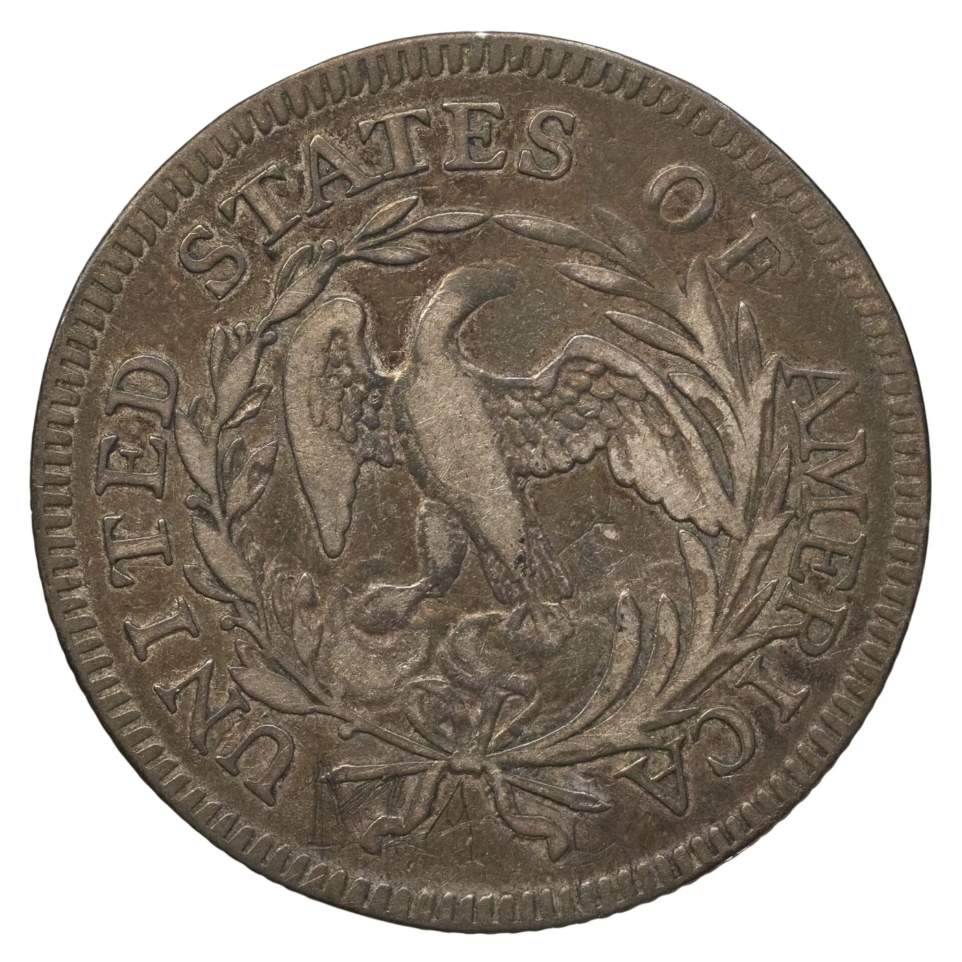 Small Eagle reverse of a 1796 Draped Bust quarter, the eagle perched inside an open wreath with UNITED STATES OF AMERICA around the rim and no denomination