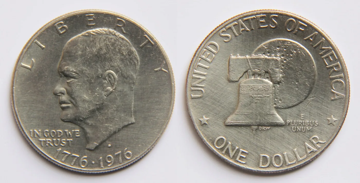 Obverse and reverse of a circulated 1976-D Bicentennial Eisenhower dollar, with a D mint mark below the bust truncation and the Liberty Bell reverse