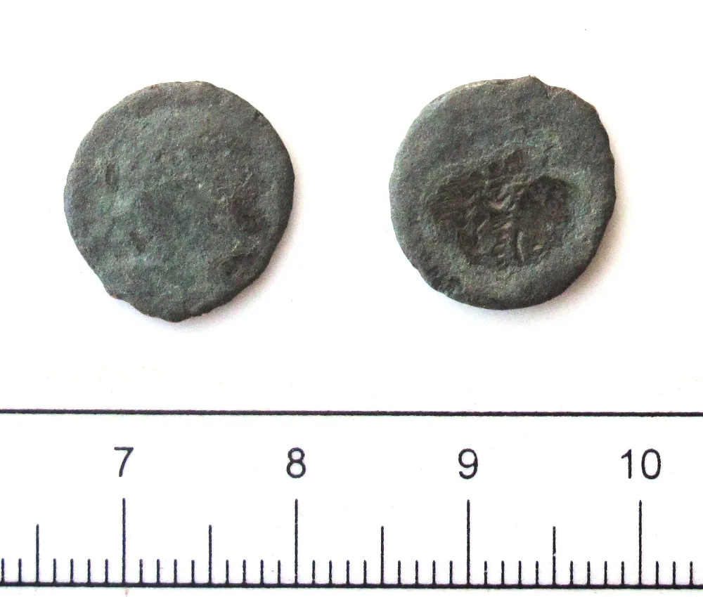 Two faces of a small Roman copper-alloy coin, one worn nearly smooth and the other showing a faint sunken impression