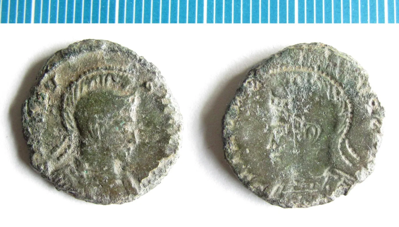 Two faces of a Roman copper-alloy coin, one showing a portrait and the other a sunken mirrored portrait