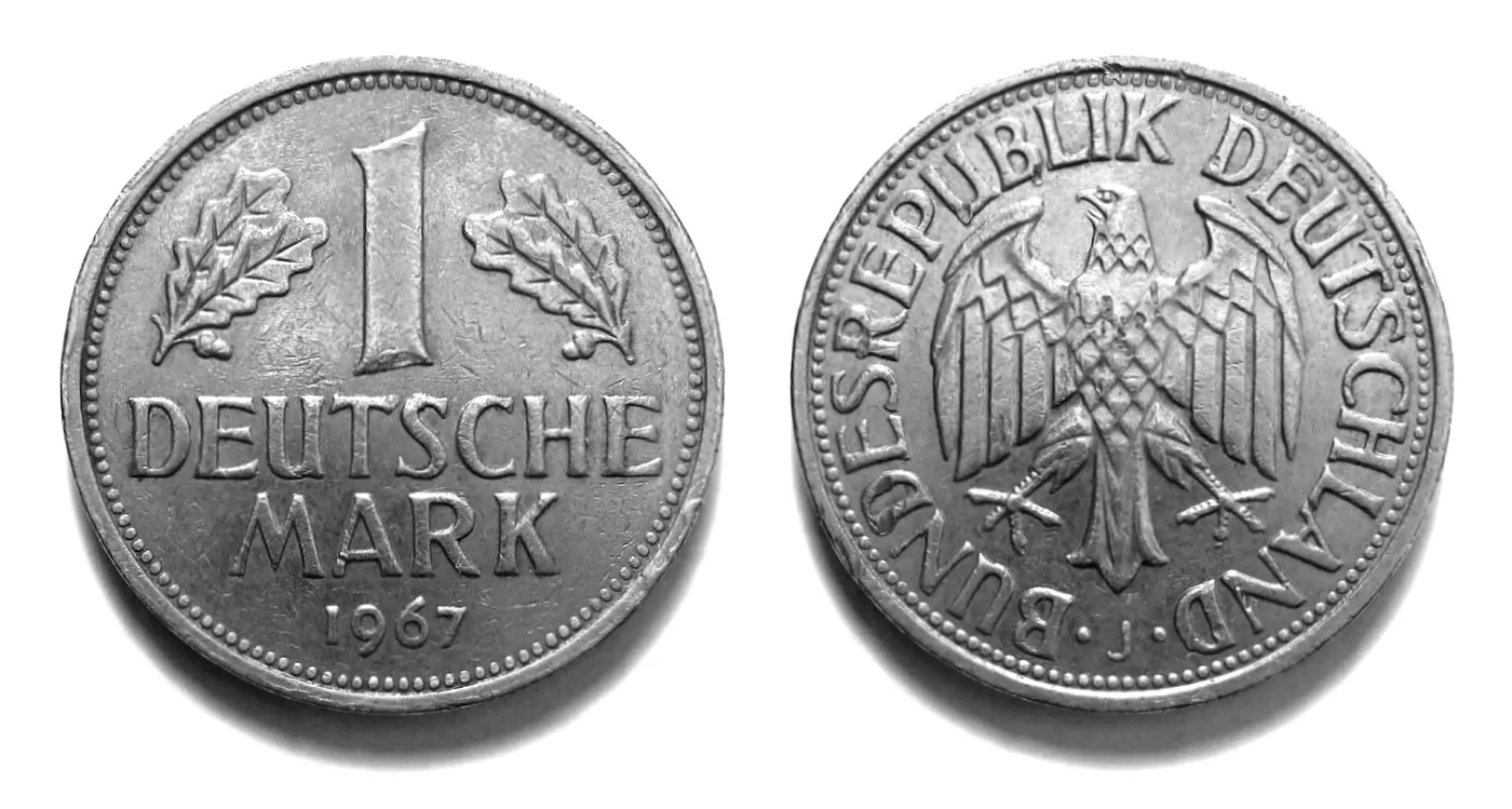 Obverse and reverse of a 1967 West German 1 Deutsche Mark, showing the denomination between oak sprigs and the federal eagle within the legend BUNDESREPUBLIK DEUTSCHLAND