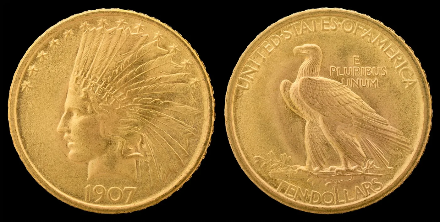 Obverse and reverse of a 1907 No Motto Indian Head eagle, showing Liberty in a feathered war bonnet and the standing eagle above TEN DOLLARS