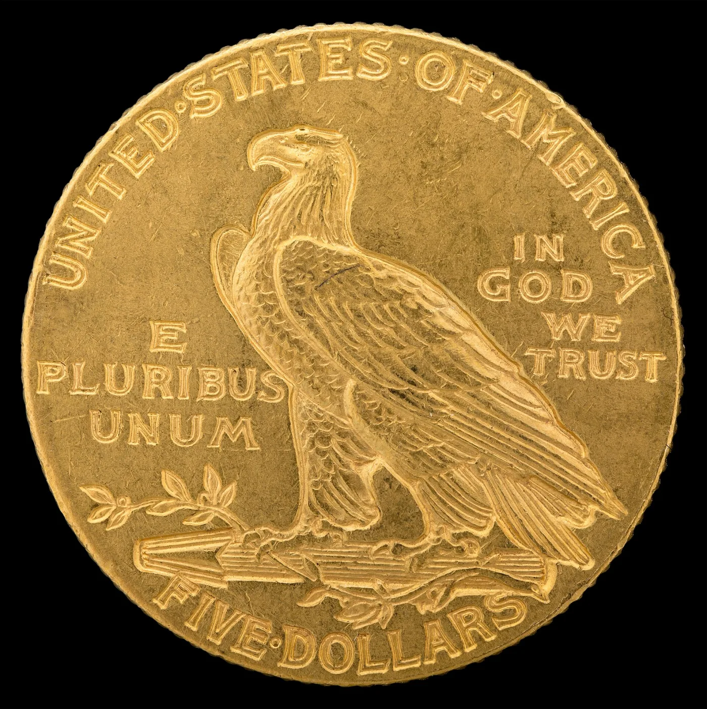 Large view of the reverse of a 1908 Indian Head half eagle, an eagle with folded wings on a bundle of arrows and an olive branch, UNITED STATES OF AMERICA above, E PLURIBUS UNUM and IN GOD WE TRUST flanking, FIVE DOLLARS below, and no mint mark