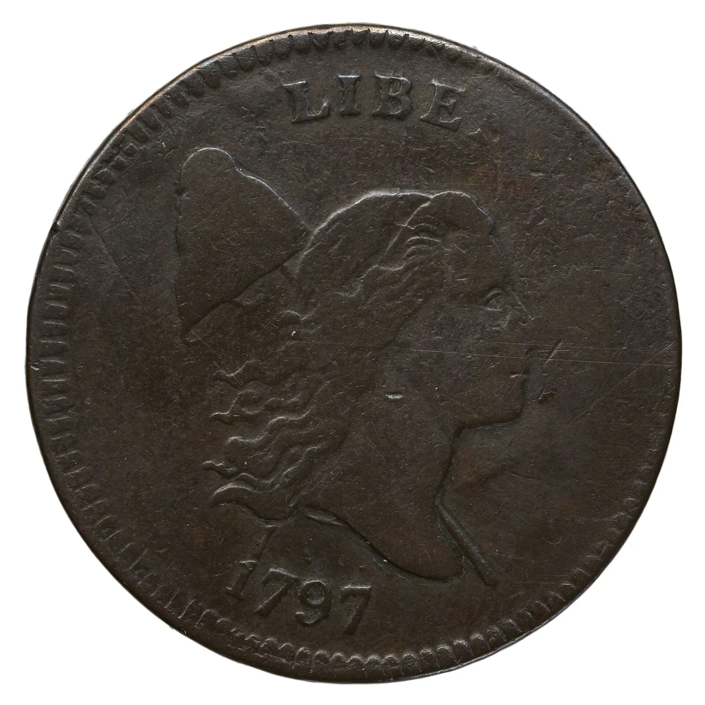 Obverse of a 1797 Liberty Cap half cent on which only the letters LIBE of LIBERTY are struck up, with the cap and pole visible behind the head and the date 1797 clear below