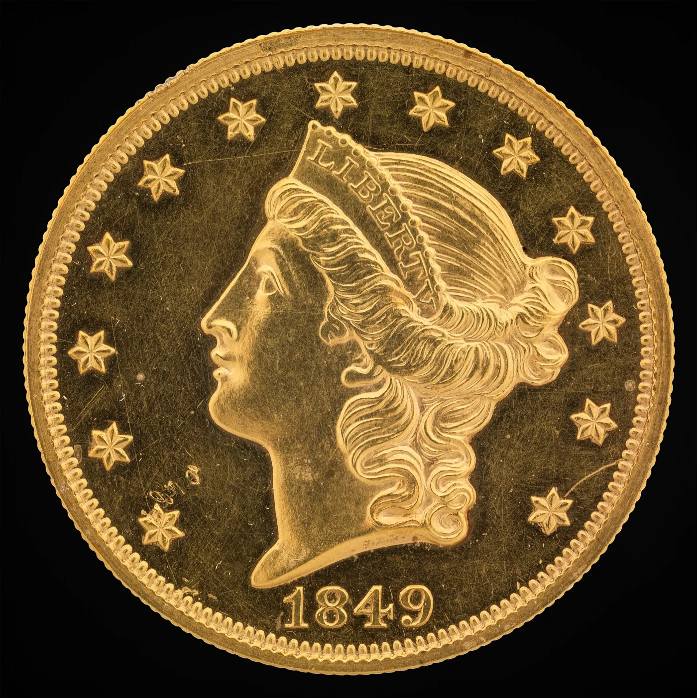 Obverse of an 1849-dated Liberty Head double eagle showing coronet Liberty facing left, LIBERTY raised on the coronet, thirteen six-pointed stars and the date 1849 below the bust