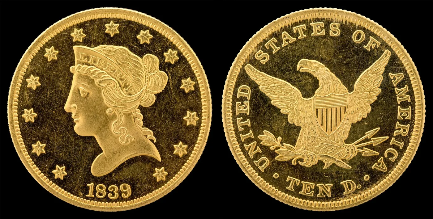 Obverse and reverse of an 1839 Liberty Head Eagle proof of the first portrait style, with a large head, tightly curled hair and the date close under the bust