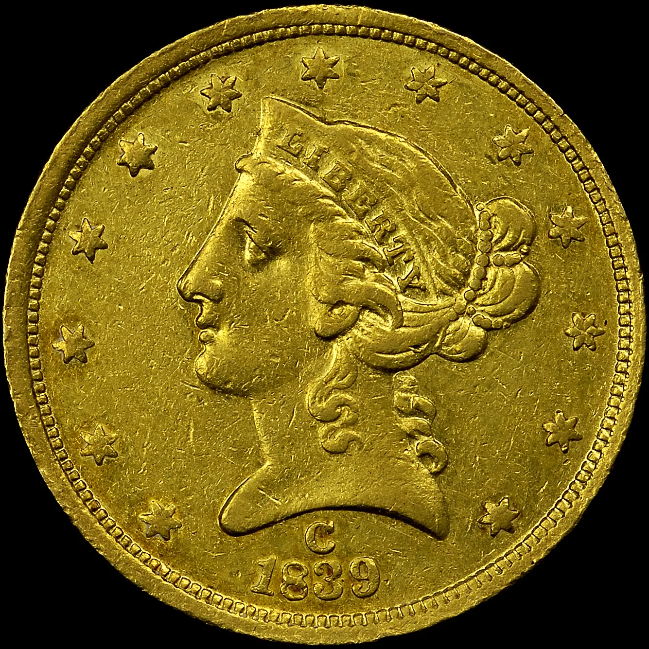 Obverse of an 1839-C Liberty Head Half Eagle, with a C mint mark punched between the truncation of the bust and the date 1839