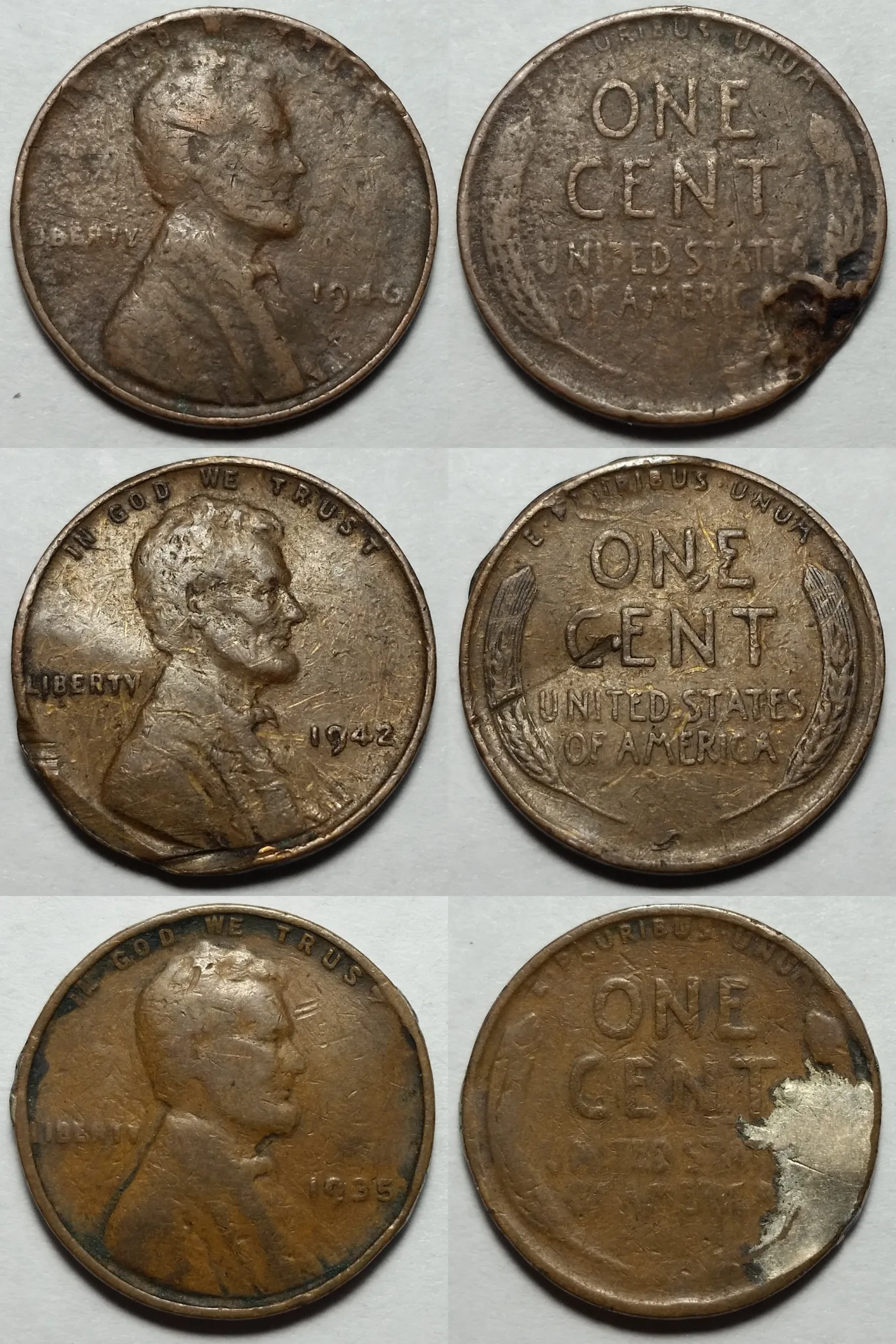 Both faces of three damaged wheat cents dated 1946, 1942 and 1935, showing corrosion pits, rim dents and scratches