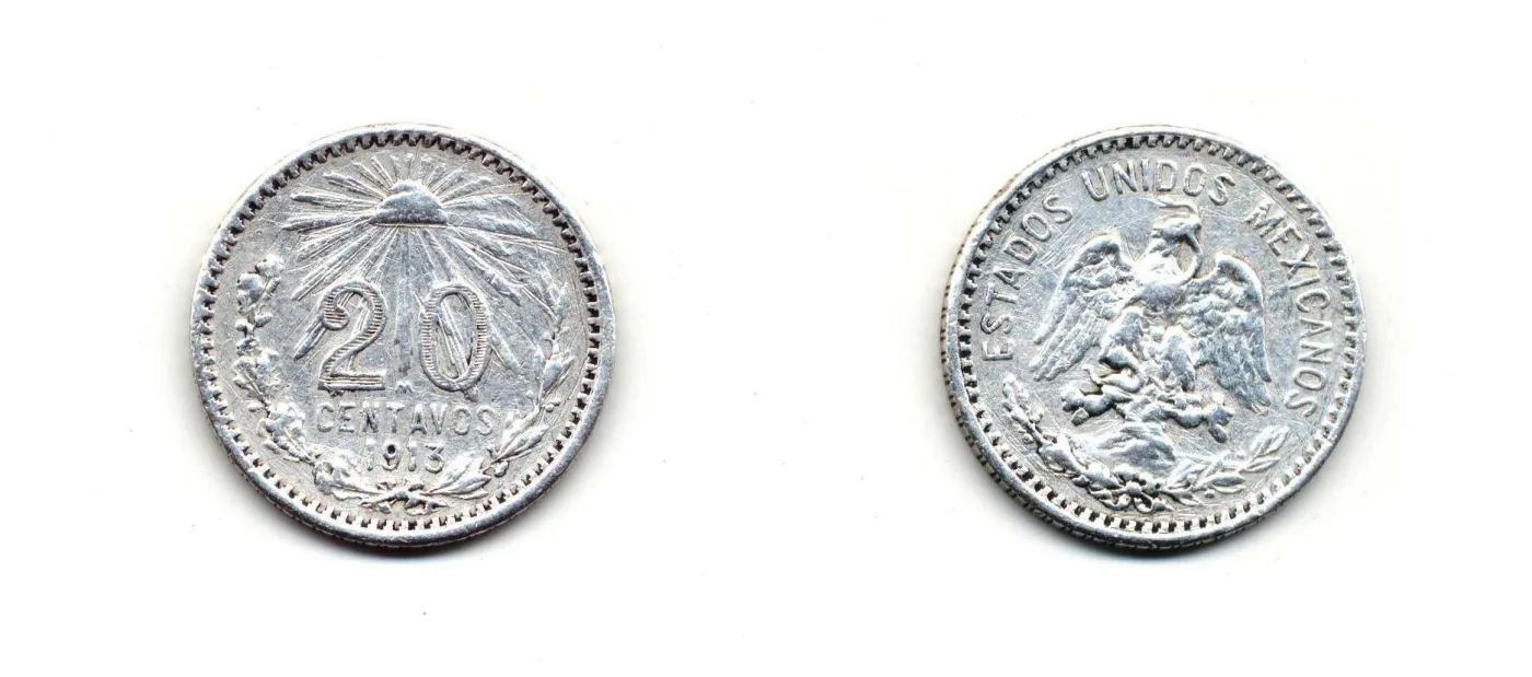 Obverse and reverse of a Mexican twenty centavos of 1913, one side with a cap and rays above the value, the other with a left-facing eagle and the legend ESTADOS UNIDOS MEXICANOS