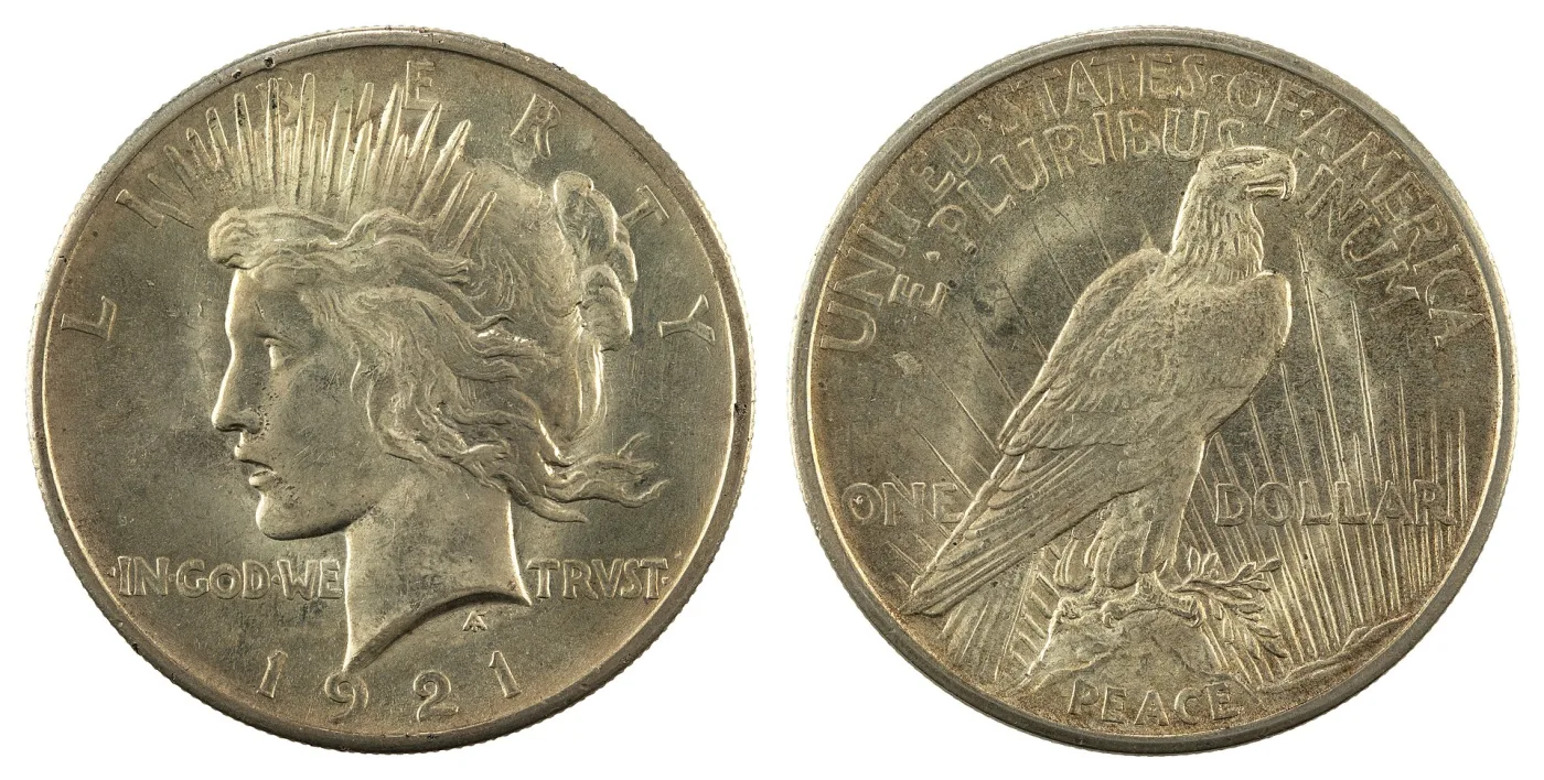 Obverse and reverse of a 1921 Peace dollar, showing Liberty in a radiate crown and the eagle at rest above the word PEACE