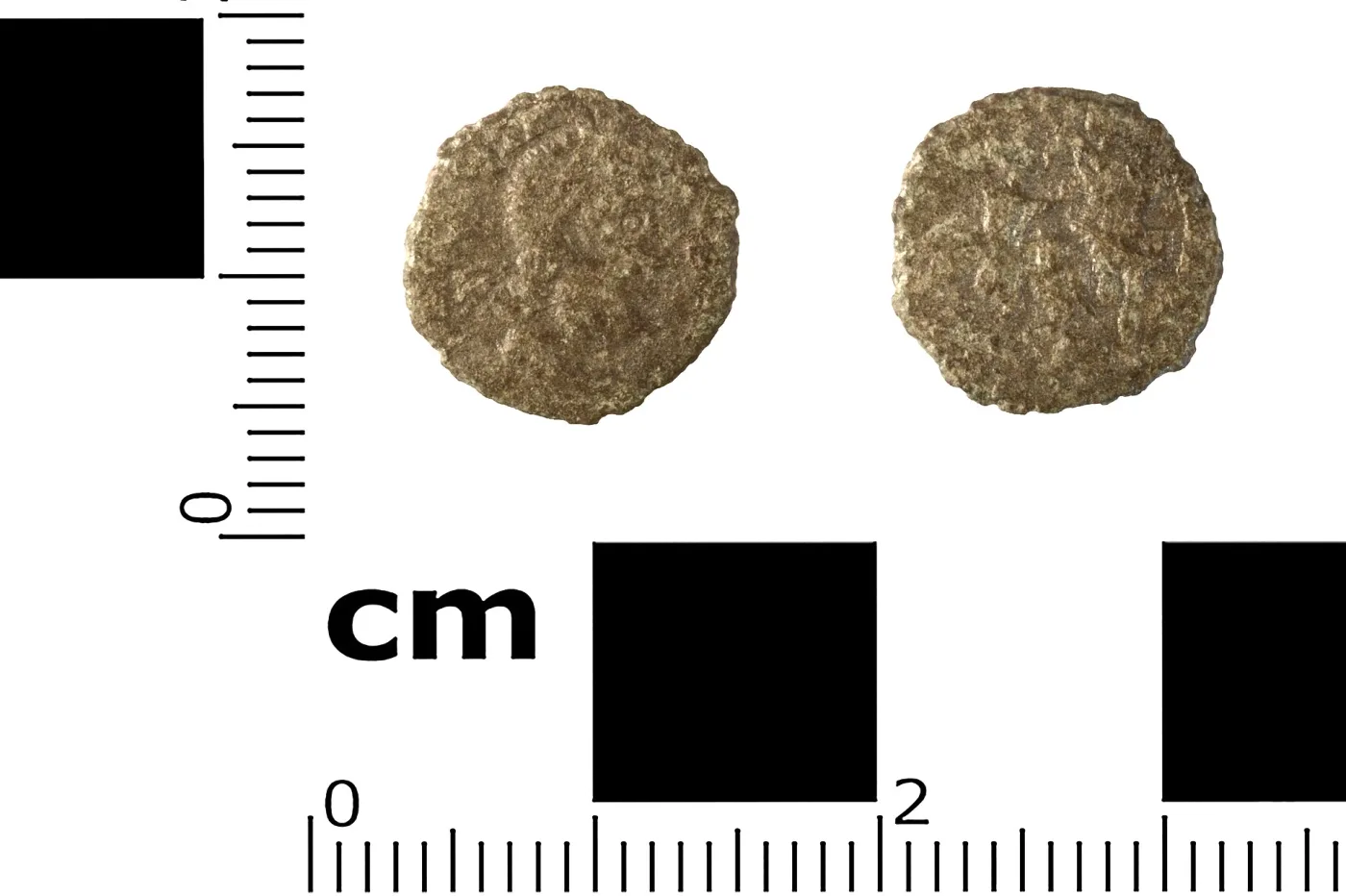 Obverse and reverse of a very small, worn Roman copper-alloy coin beside a centimetre scale, a diademed bust on one side and an indistinct figure group on the other