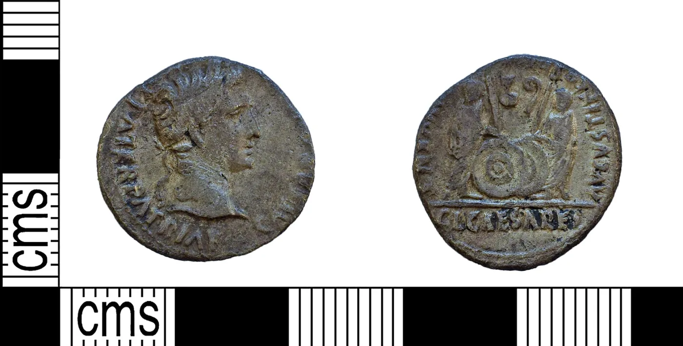 Silver denarius of Augustus with his laureate head on the obverse and, on the reverse, two togate figures behind two shields and spears above the legend C L CAESARES