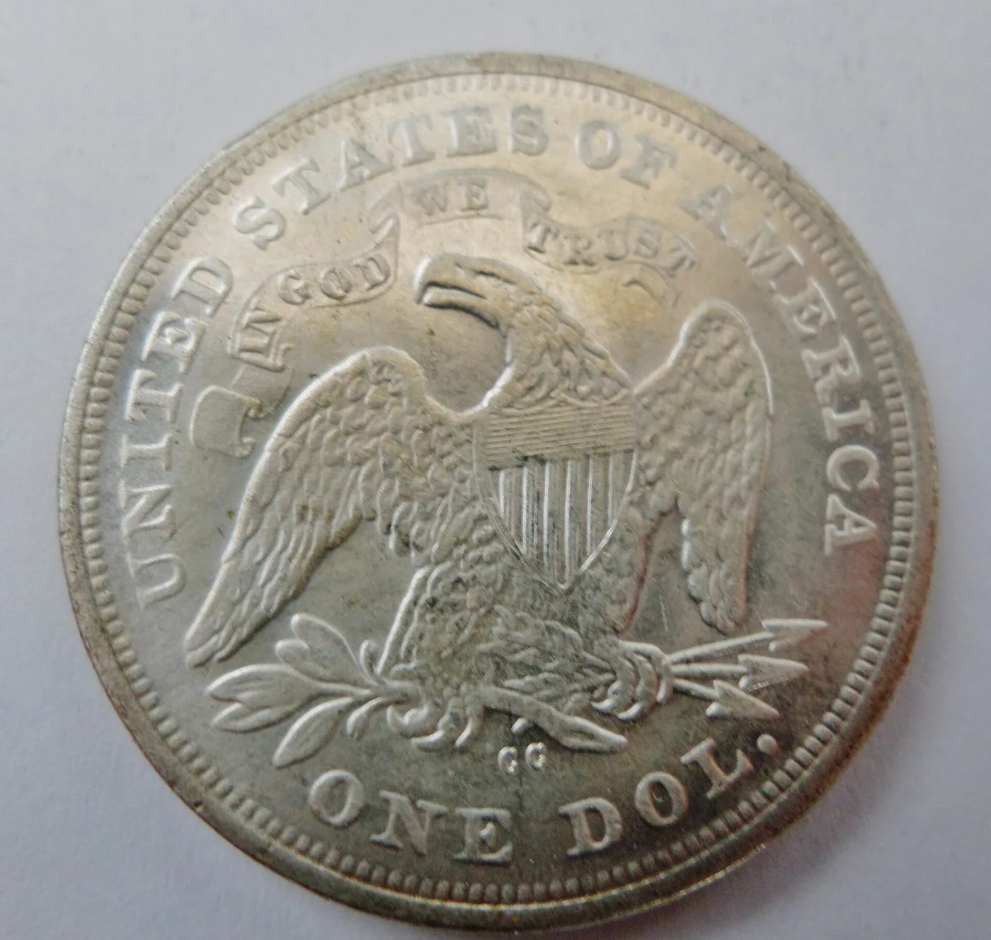 Reverse of an 1872-CC Seated Liberty dollar with the CC mint mark below the eagle, between the tail feathers and ONE DOL.