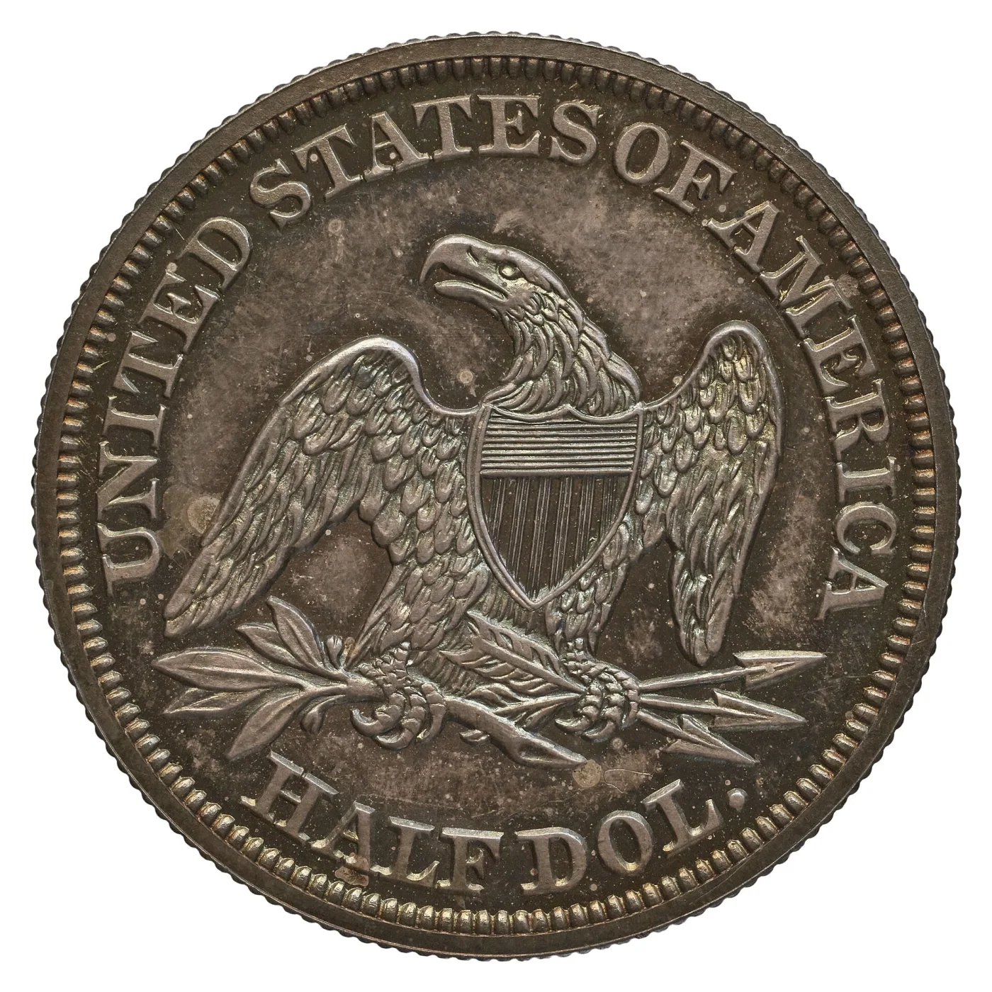 Reverse of an 1850 Seated Liberty half dollar with the heraldic eagle, a striped shield, olive branch and arrows, and HALF DOL. below, with no motto and no mint mark