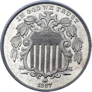 Obverse of an 1867 Shield nickel showing the federal shield with a cross at its top, the chief's horizontal lines, the vertical pales, flanking olive branches, crossed arrows below and IN GOD WE TRUST arching above